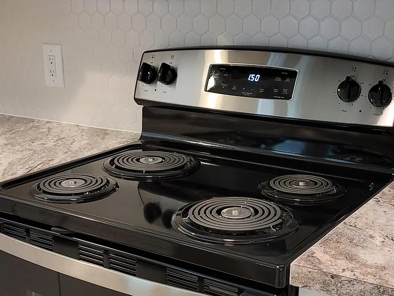 New stainless steele stove and vent hood.