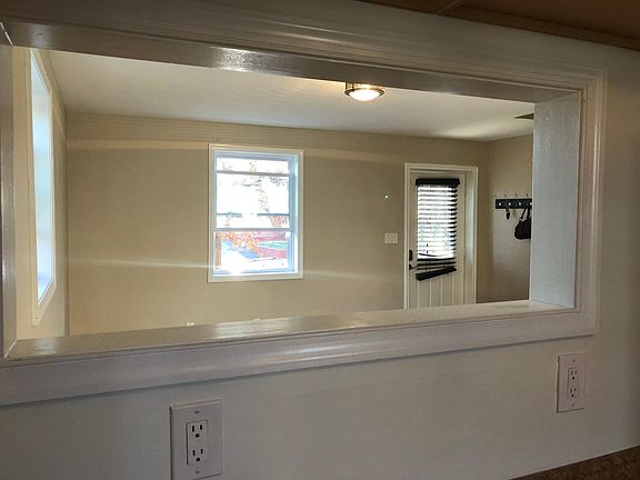 Window in Living room with view to kitchen