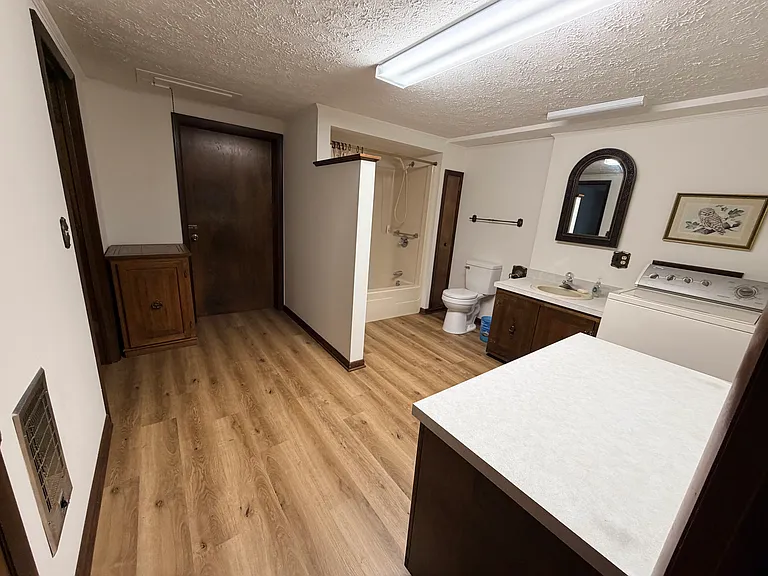 Door to garage area with Dryer