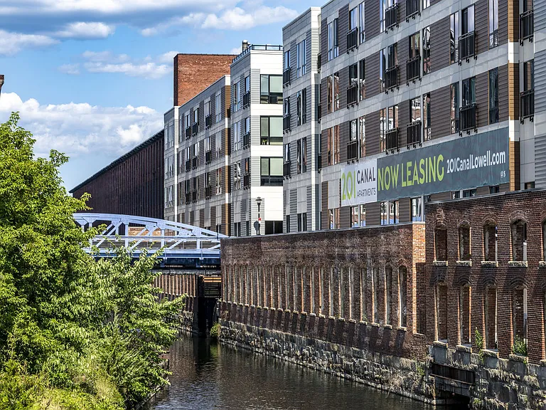 Back Of Building Showing Historic Remnant Wall And Canal