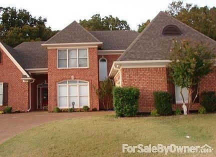 Curb View : Inverted Front porch Red Door, side 2 car garage. Crape Myrtles both sides.