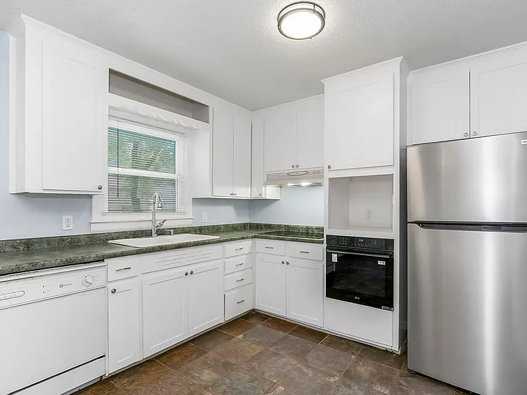 stove top, oven, and refridgerator were installed in 2025, spot for microwave above wall oven