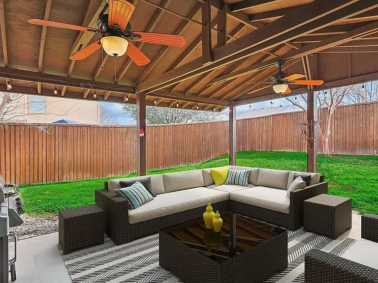Covered patio- fan with light, includes grill hookup. LED outdoor lights around inside of patio area.