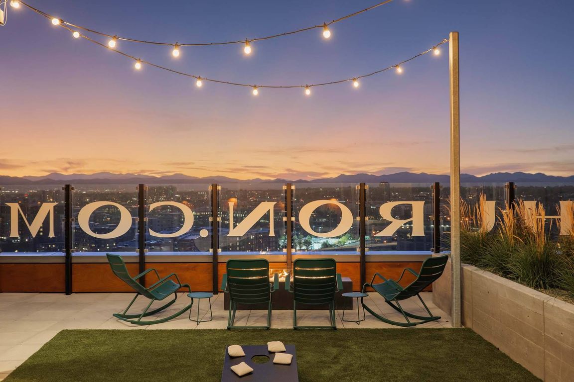 Cozy up on the rooftop with a warm fireplace and ambient lighting, perfect for evening relaxation.