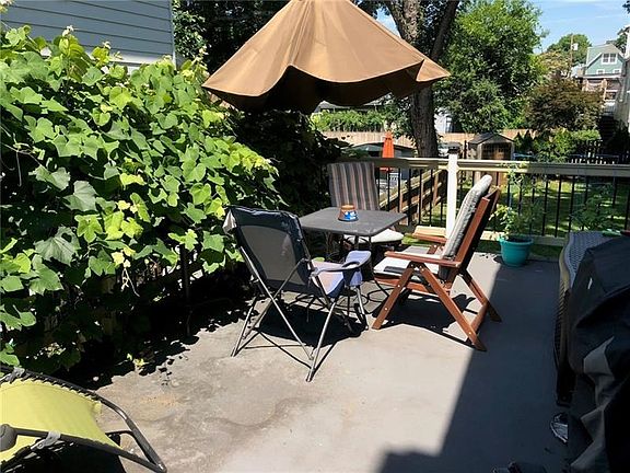 Deck. Maintenance free concrete with hand rails provide a safe place for children, too. Natural vegetation gives it a semi-priva