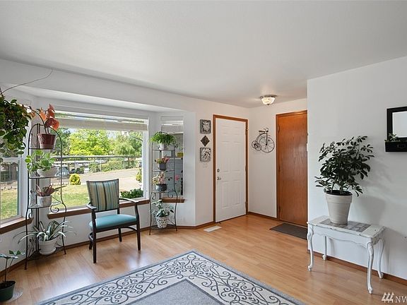 Walking through the front door you are met with this lovely natural light-filled living room to greet you as you come home from your day