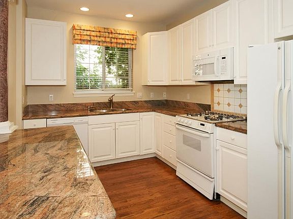 kitchen with pantry, gas stove, ample storage.