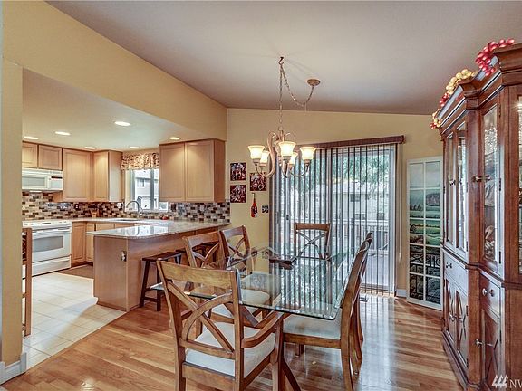 A suitable dining area with room enough for a china cabinet. 