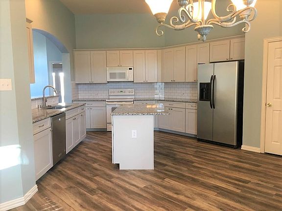 Kitchen - all new cabinets and flooring. Fridge is included.