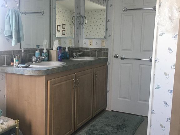 Double sink in master bath. Also has walk-shower