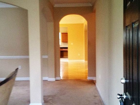 View of entrance hallway to LV and towards kitchen