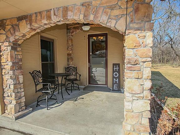 Home To Sweet Home! Closer view of entrance with intricate brick and stone work which offers so much character to this home!