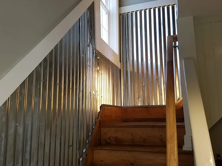 Inside the front door, up the stairs to the 2nd floor to apartment 3 and 4.