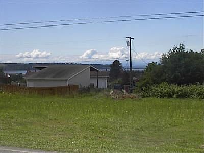 Property has views of Drayton Harbor. A two story home would allow for a better view.