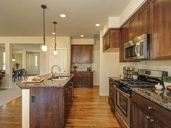 Alder Cabinets & Solid Oak Hardwood floors installed & finished on-site