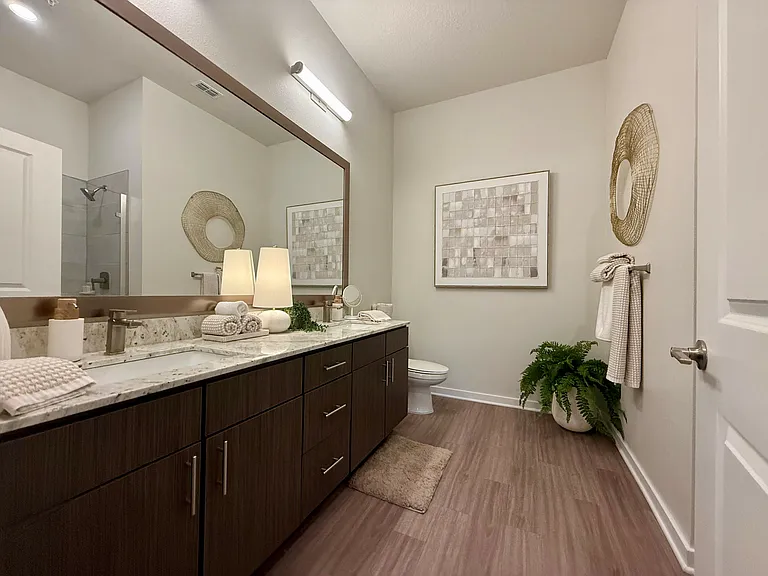 Integra Palms: Experience the tranquility of this beautifully designed bathroom, perfect for relaxation and style.