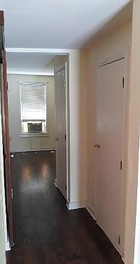 closet hallway leading to living room