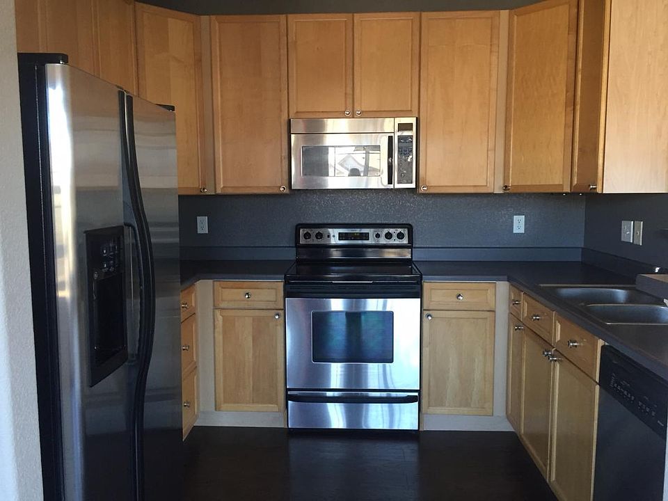 Kitchen - newer hardwood floors. Stainless steel appliances