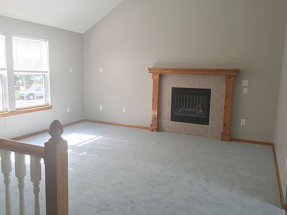 Living Room w/ Vaulted Ceilings & Fireplace