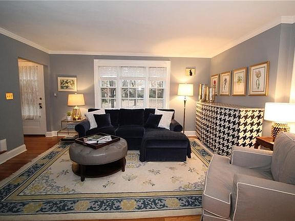 The living room as seen from the dining room. Notice the large windows!