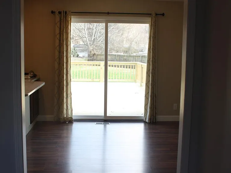 open floor plan leads to big back fenced yard