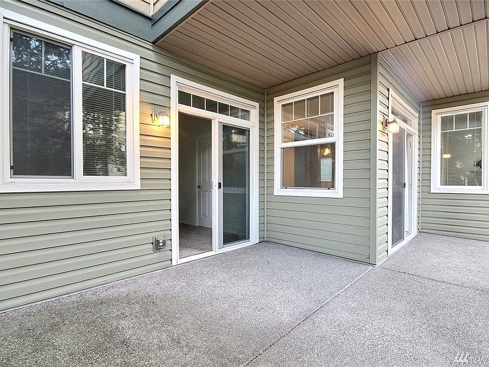 Imagine sipping your morning coffee/tea here on your covered + uncovered wrap around patio, with two sliders! Perfect for year 'round enjoyment.
