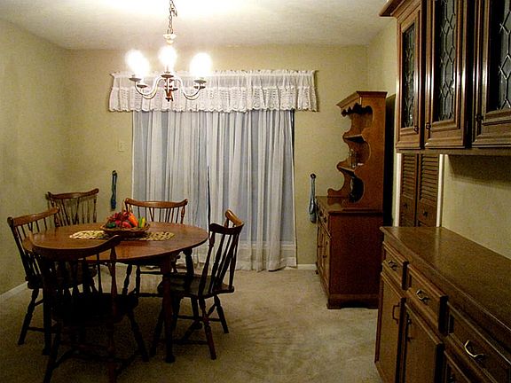 Dining Room with large Window and built in cabinet