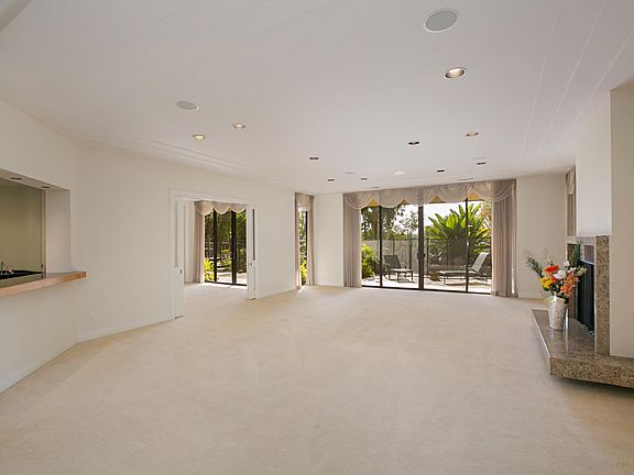 Formal living room with fireplace and wet bar