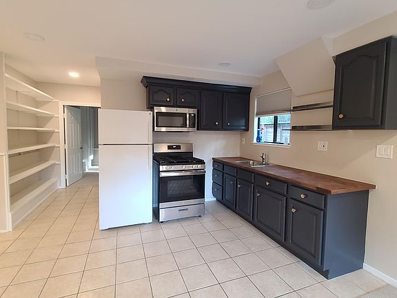 Larger view of kitchen and hallway