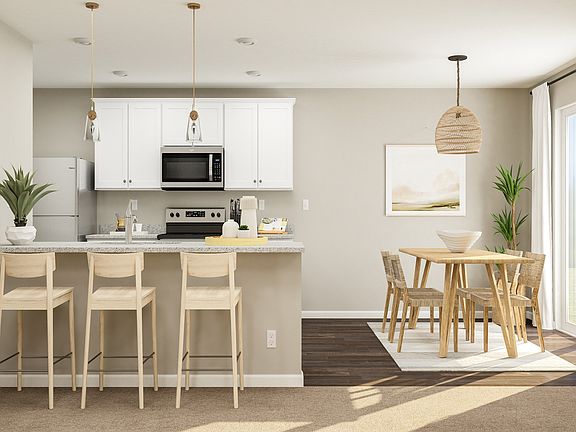 The kitchen includes a breakfast bar