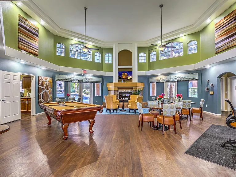 Large resident clubhouse with billiards table, personal computers, television and fireplace.