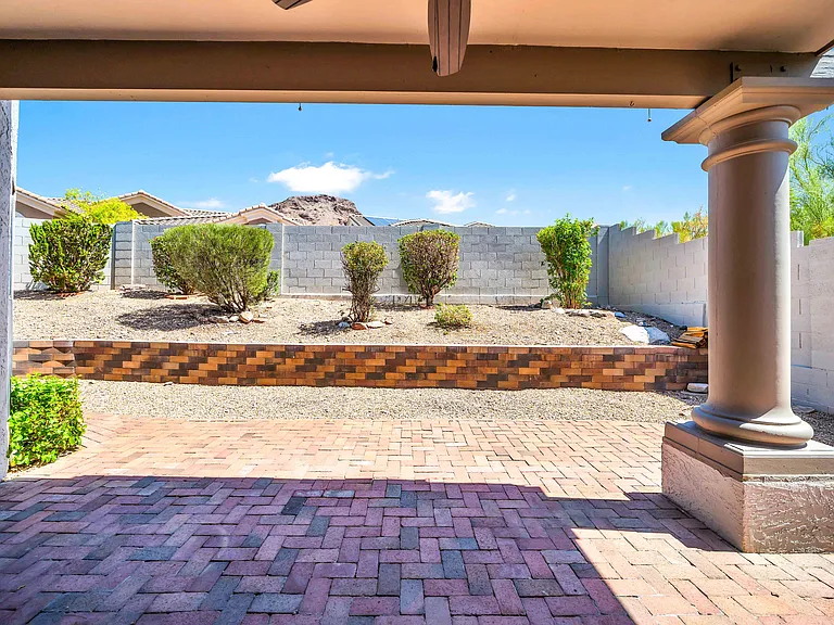 Quiet backyard patio off the family room sliding glass doors.