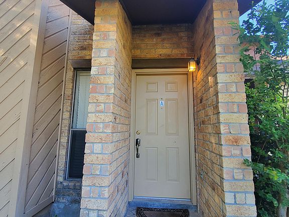 Front covered entry with lighting.