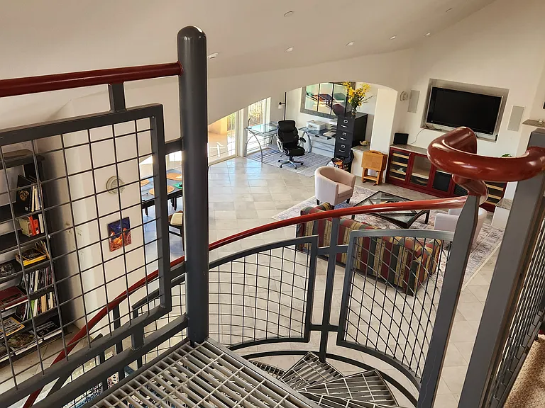 The living space and work corner from the staircase.