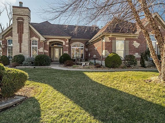 The intricate Brick and Stone Detail completes this classic Country French Elevation.  The architectural Roof was recently added.  Notice the Hip Structure of the roof and the soaring gables for interest.  The towering fireplace on this elevation is located in the flex Room off the Main Entry.