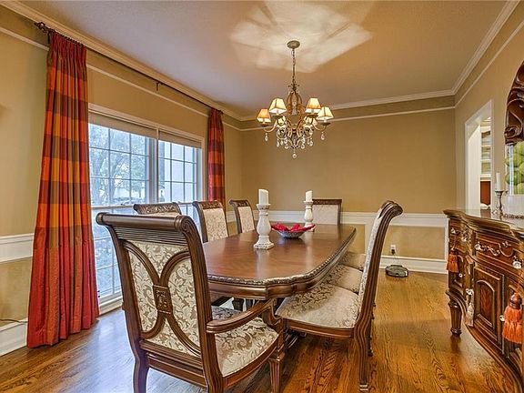 Spacious formal dining room with wood floors