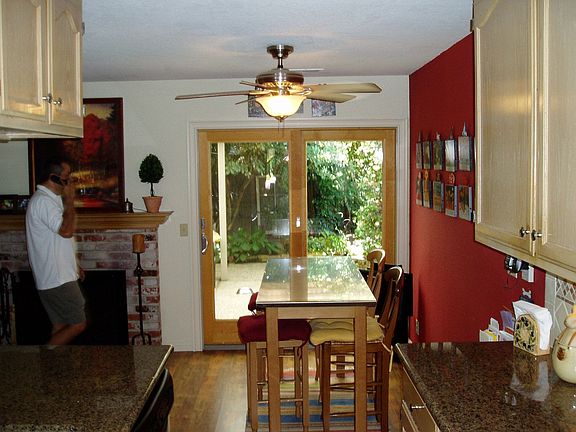 Separate eating area off kitchen leading to backyard and patio.