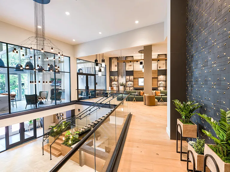 Designed to impress from every angle, this elevated lounge level blends striking architecture, statement lighting, and views of the vibrant community below.