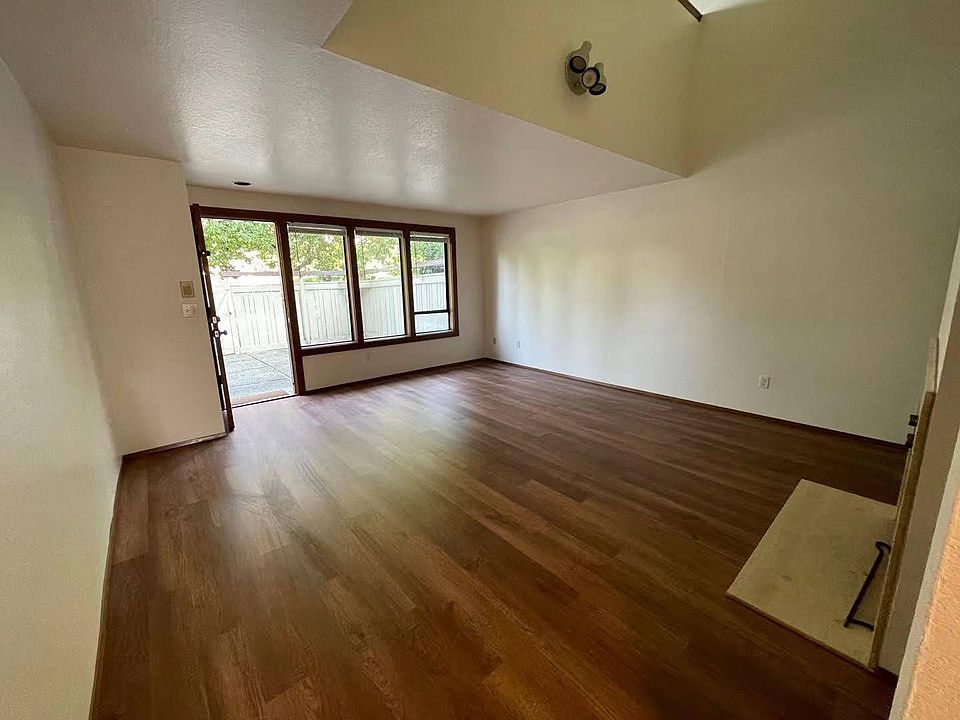Living room looking at the front door and patio
