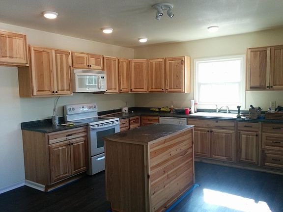 Kitchen - includes refridgerator, stove, microwave, island and lots of cabinet space as well as a pantry
