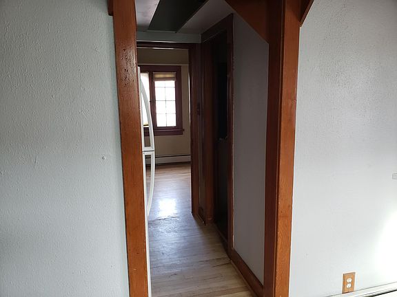 hallway leading to upstairs bedroom and upstairs bathroom