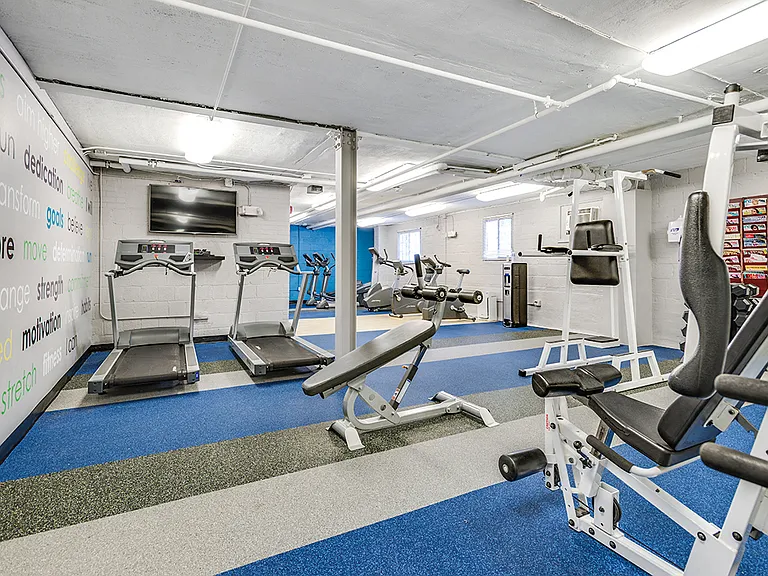 Fitness center with treadmills, machines and free weights