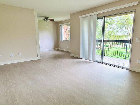 This is the living room layout for all apartments. The patio/balcony is quite large and standard for all homes.

Upgraded Plank Flooring In Downstairs Remodeled Apartments. Most upstairs units have carpet.