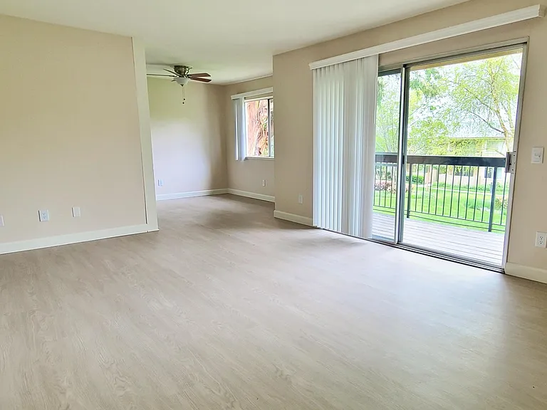 This is the living room layout for all apartments. The patio/balcony is quite large and standard for all homes.
Upgraded Plank Flooring In Downstairs Remodeled Apartments. Most upstairs units have carpet.