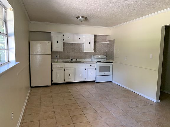 Kitchen and living room are all one room.