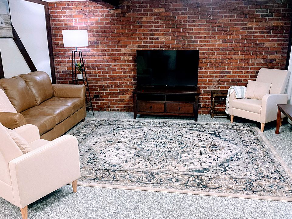 Warm and inviting living space with an open floor plan to the dining/work space and kitchen