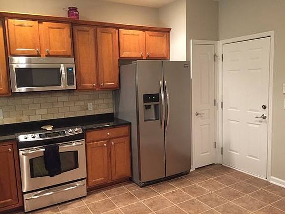 Kitchen with door leading to 2-car garage