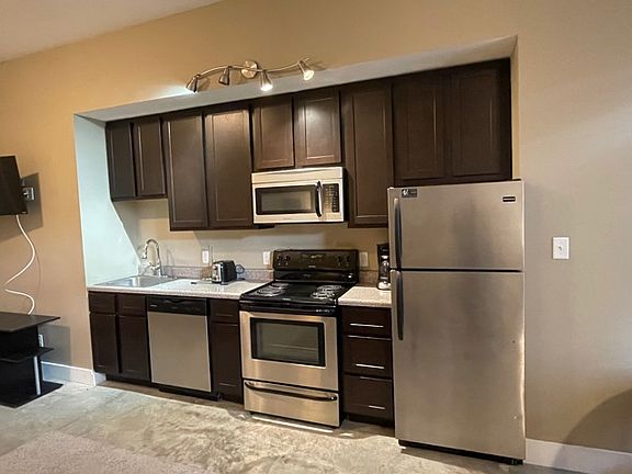 Nice size kitchen with stainless appliances.