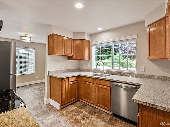 The user-friendly kitchen offers new quartz counters and an undermount stainless sink. 