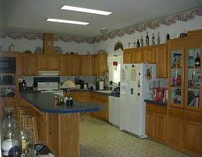 Beautiful kitchen located between living and family rooms.